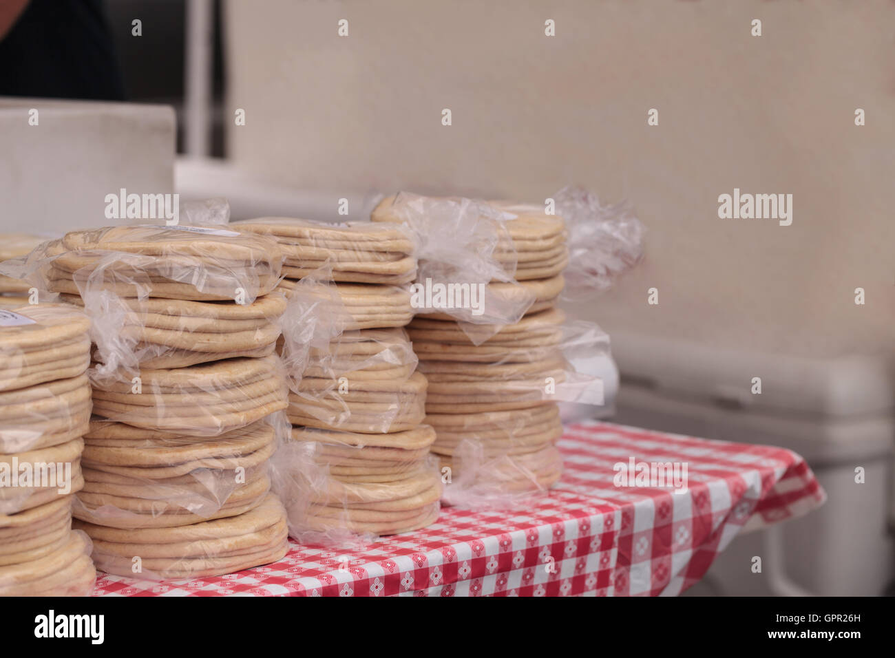 Handmade Tortilla bread stacked in bags and ready for sale at a farmers