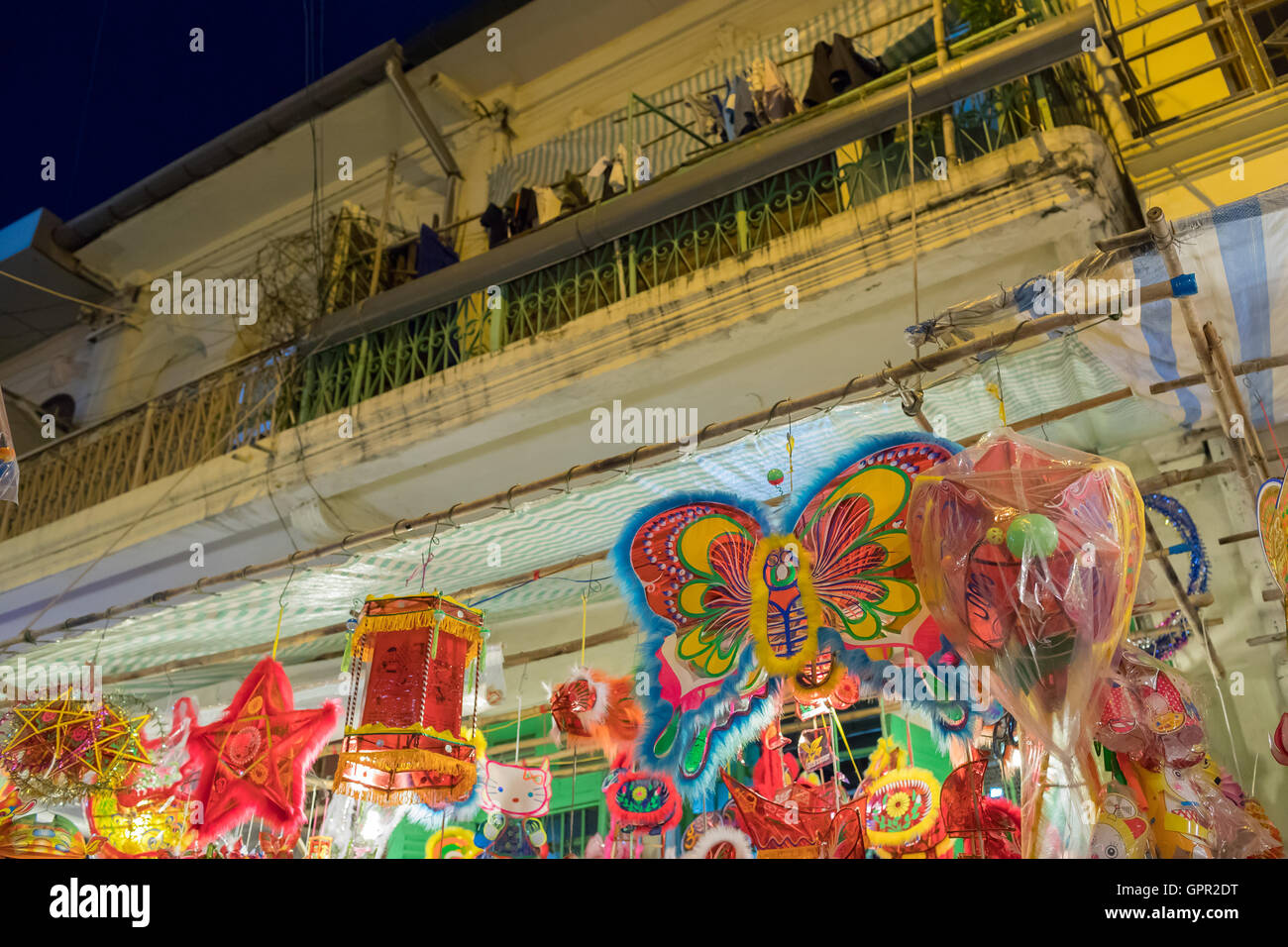 Lanterns hanging on a stand in the streets of Cholon in Ho Chi Minh ...