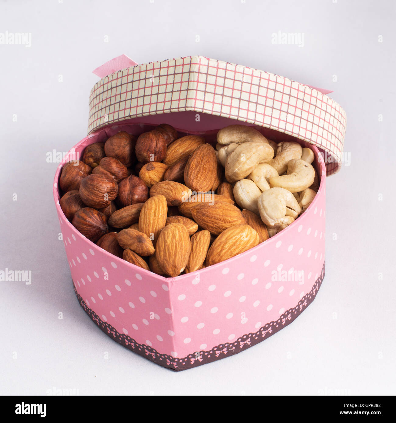 Nuts in a gift box Stock Photo Alamy