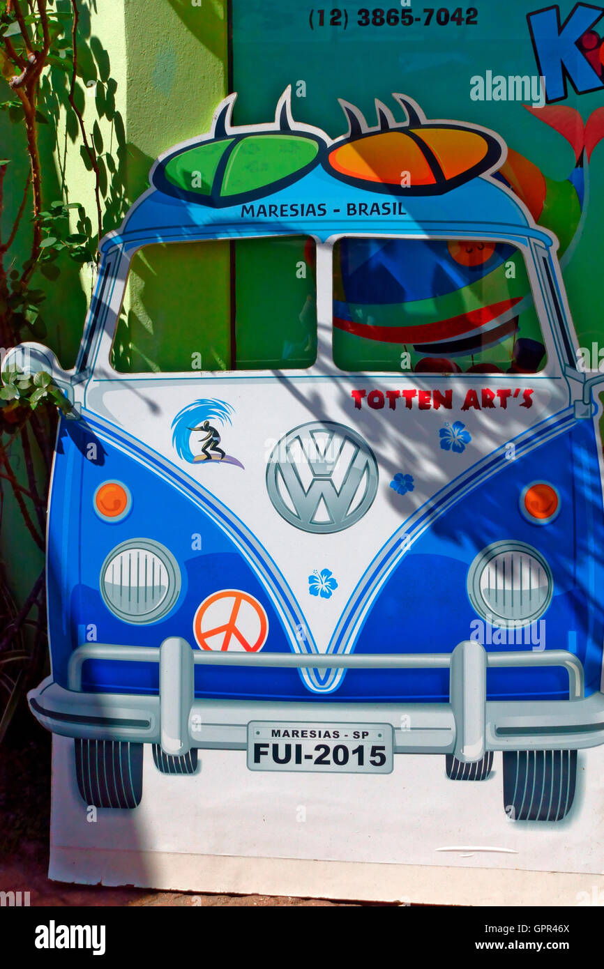 Advertising campervan with surf boards on top, outside a shop in the Brazilian surfing  town of Maresias Stock Photo