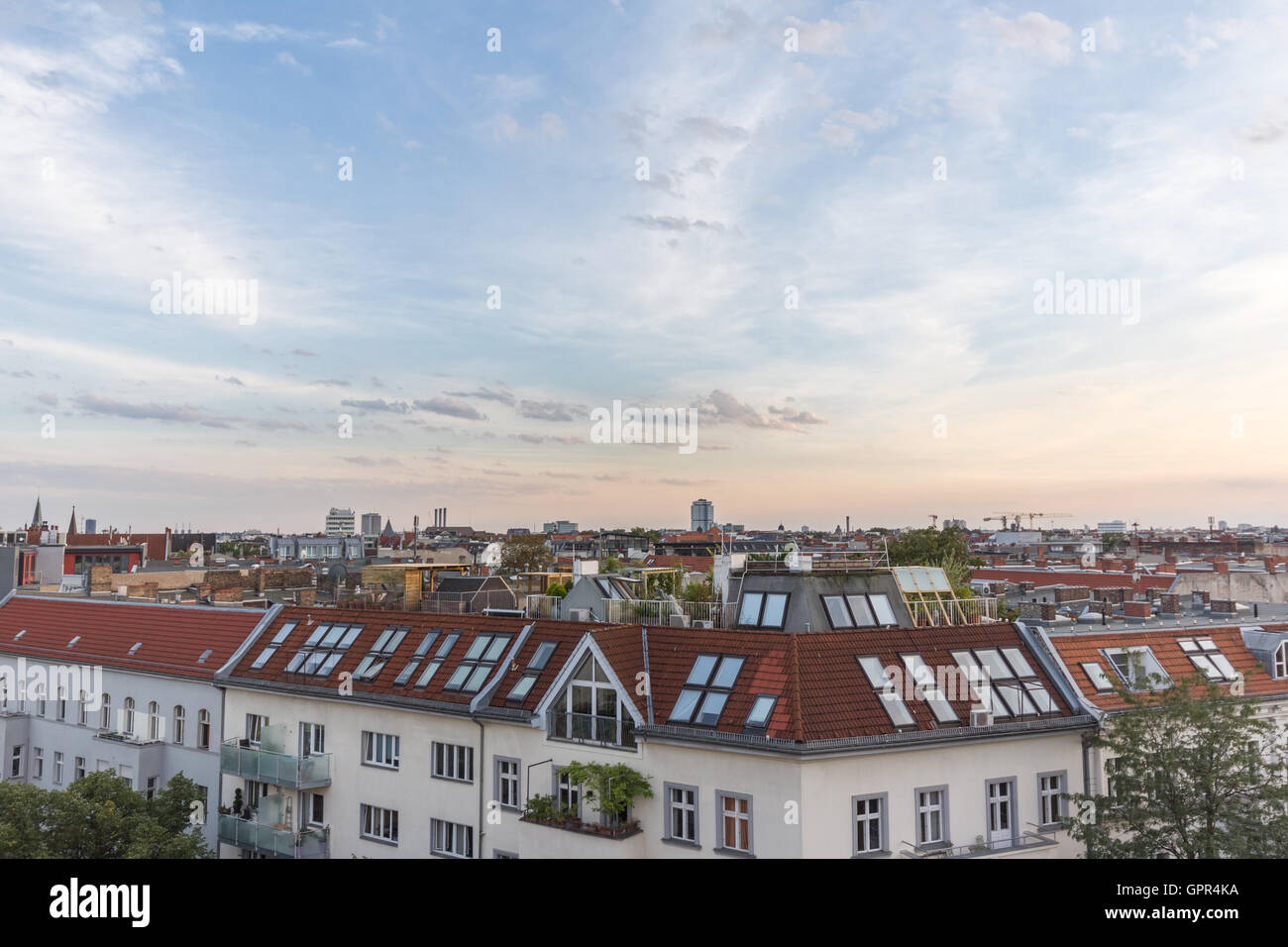 View over rooftops - city skyline at sunset Stock Photo