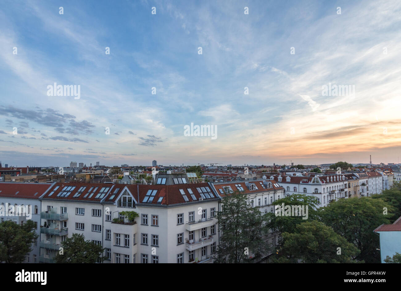 View over rooftops - city skyline at sunset Stock Photo