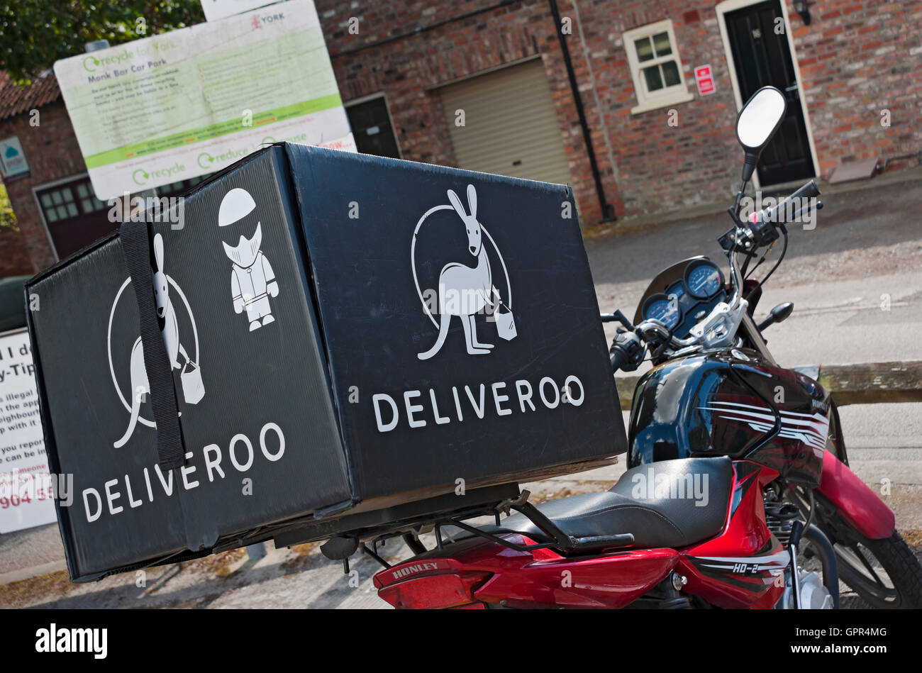 Close up of Deliveroo courier delivery bike England UK United Kingdom GB Great Britain Stock Photo