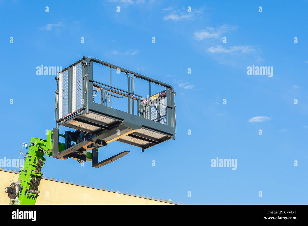 Forklift telescopic boom with buckets and aerial working platform. Stock Photo