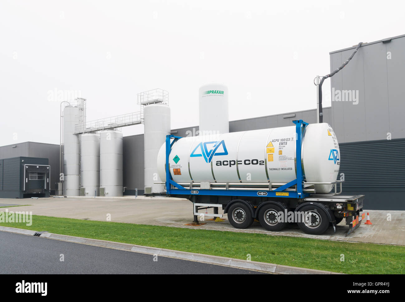 OLDENZAAL, NETHERLANDS - JANUARY 1, 2016: Exterior of a food processing factory with a trailer with chemical liquids in front Stock Photo