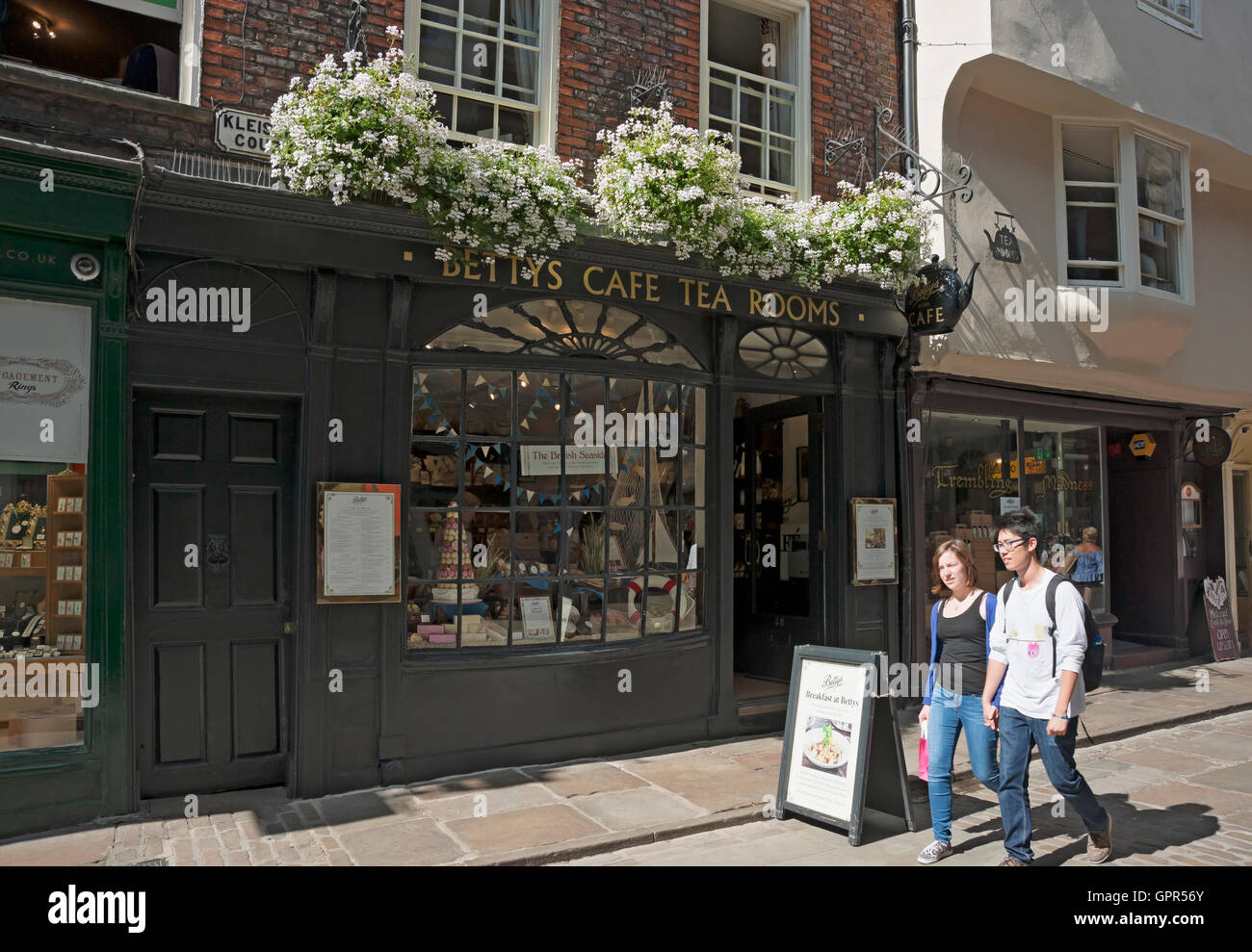 People tourists visitors outside Little Bettys cafe and tea rooms in summer Stonegate York North Yorkshire England UK United Kingdom GB Great Britain Stock Photo