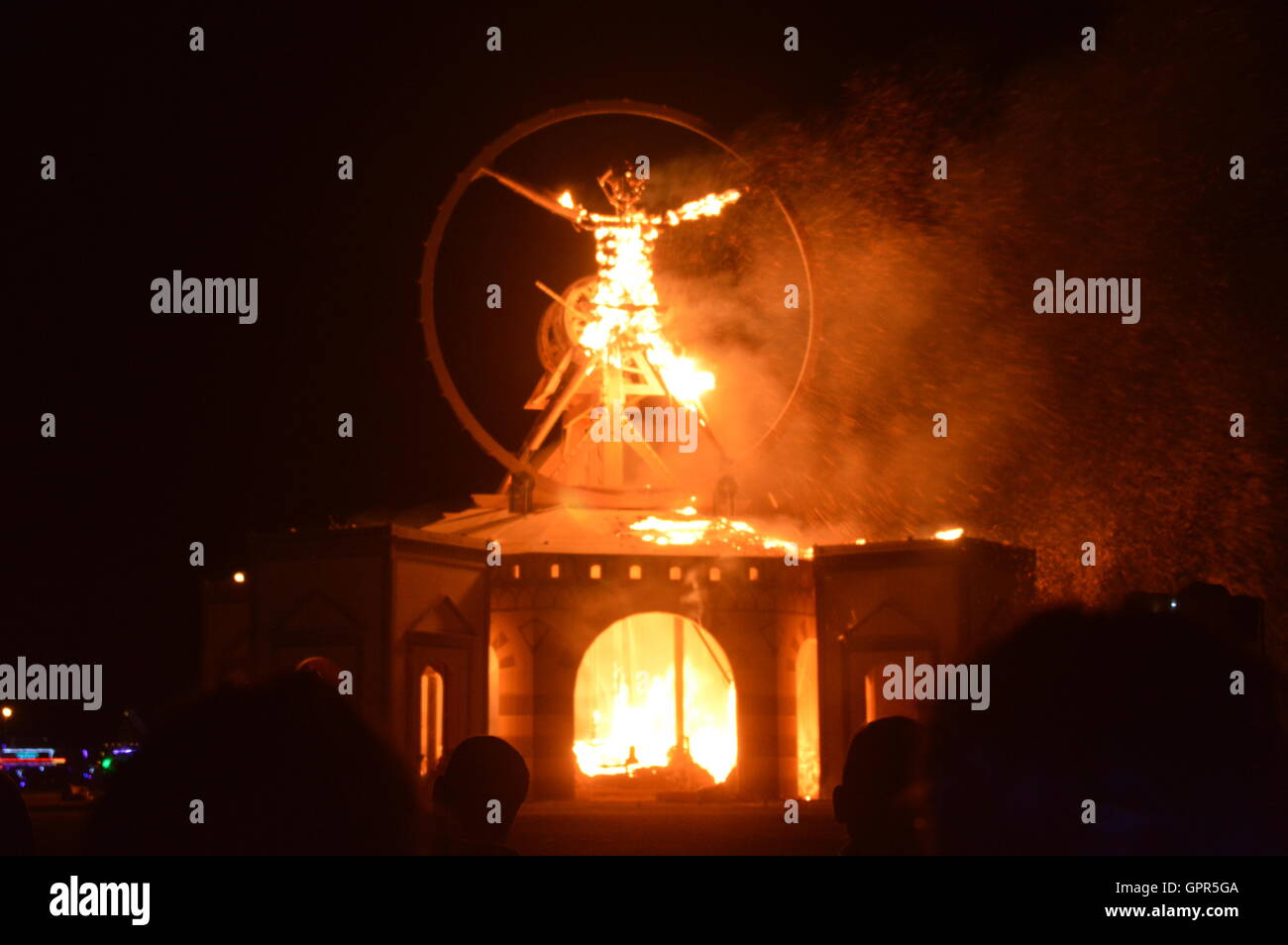 The Burning Man sculpture is set fire during the final celebration at the annual desert festival Burning Man September 3, 2016 in Black Rock City, Nevada. Stock Photo