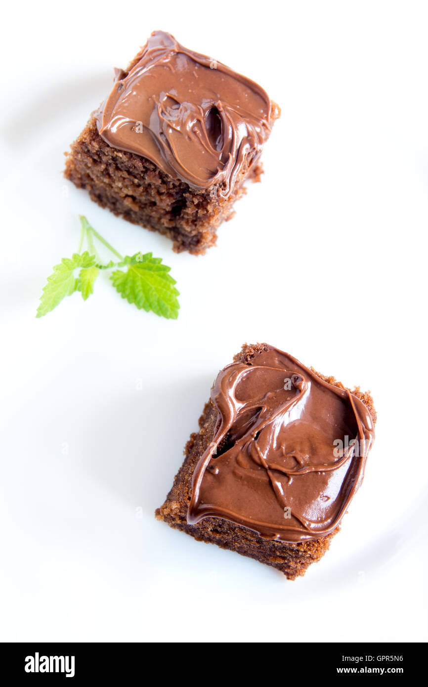 Chocolate Mini Cakes With Chocolate Icing And Mint On White Plate Stock Photo Alamy