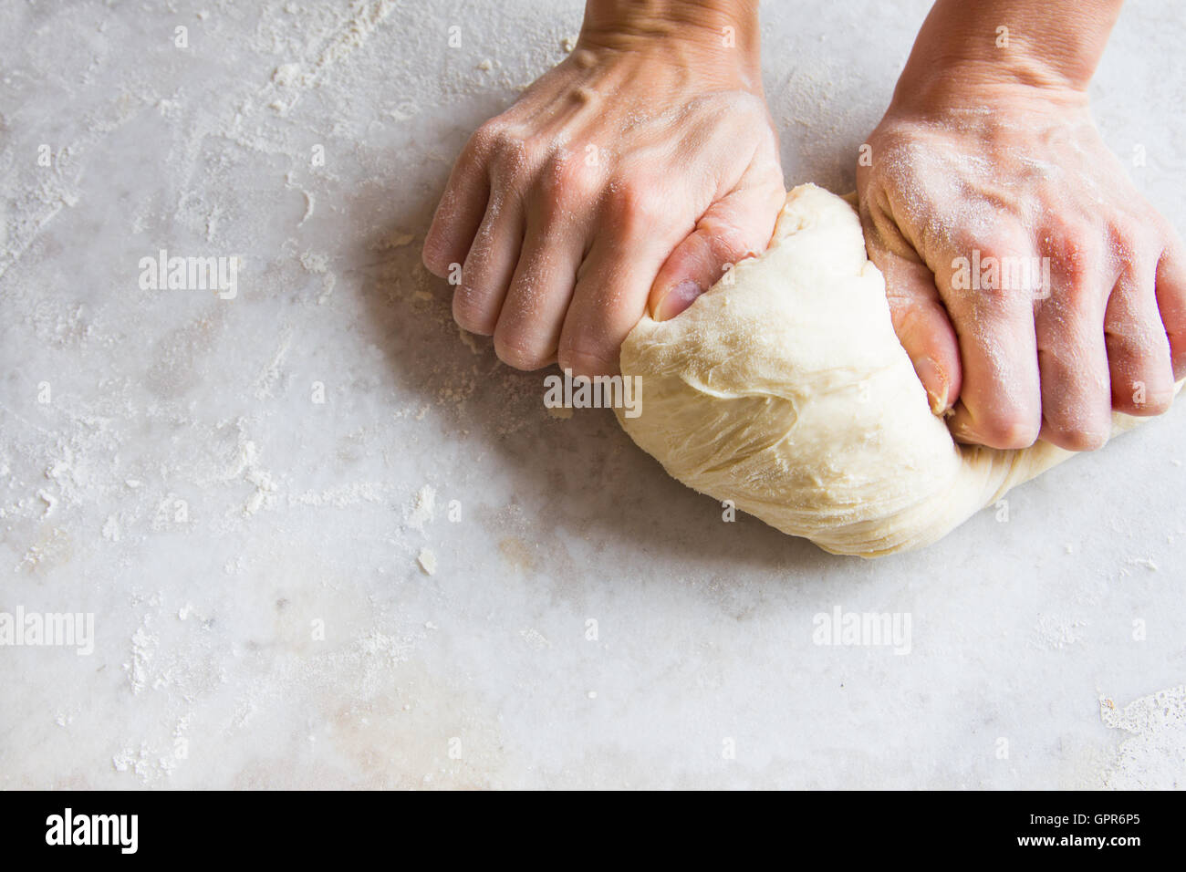 Hands knead dough on cutting board for homemade bakery Stock Photo Alamy