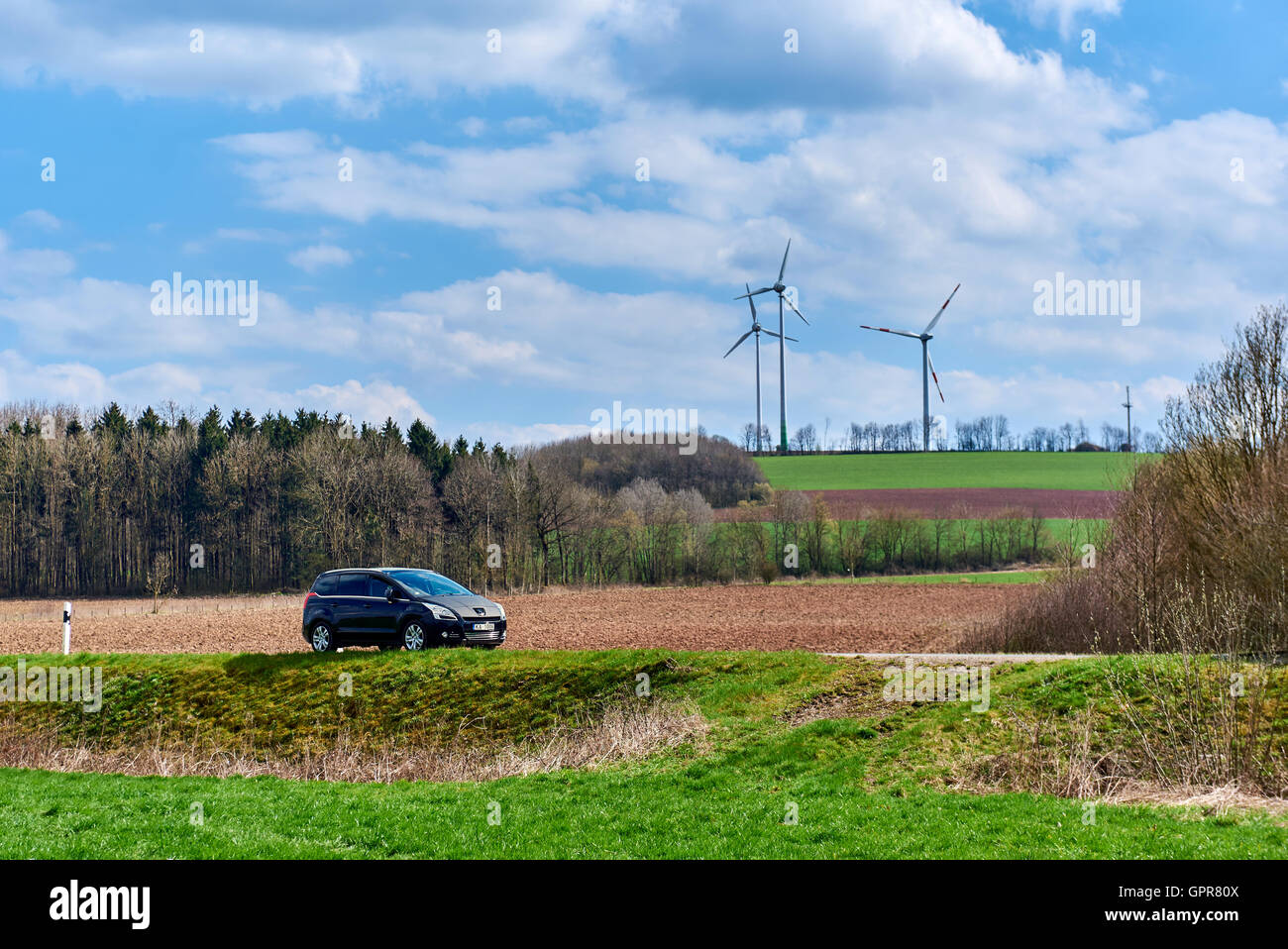 Black color Peugeot 5008 stopped on a rural road in Germany Stock Photo