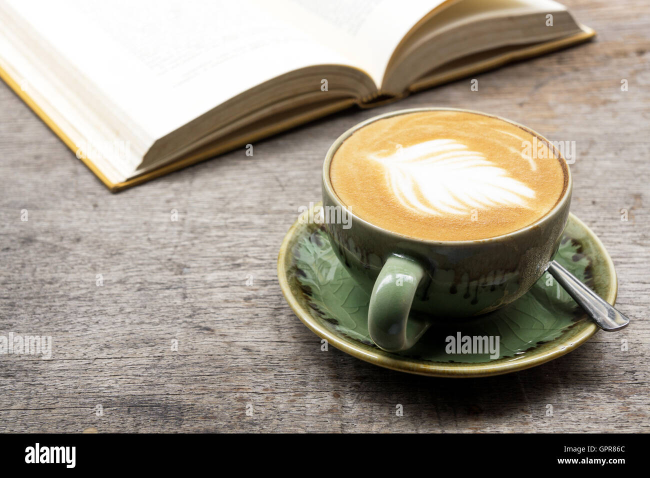 Leisure reading book with a cup of coffee latte Stock Photo