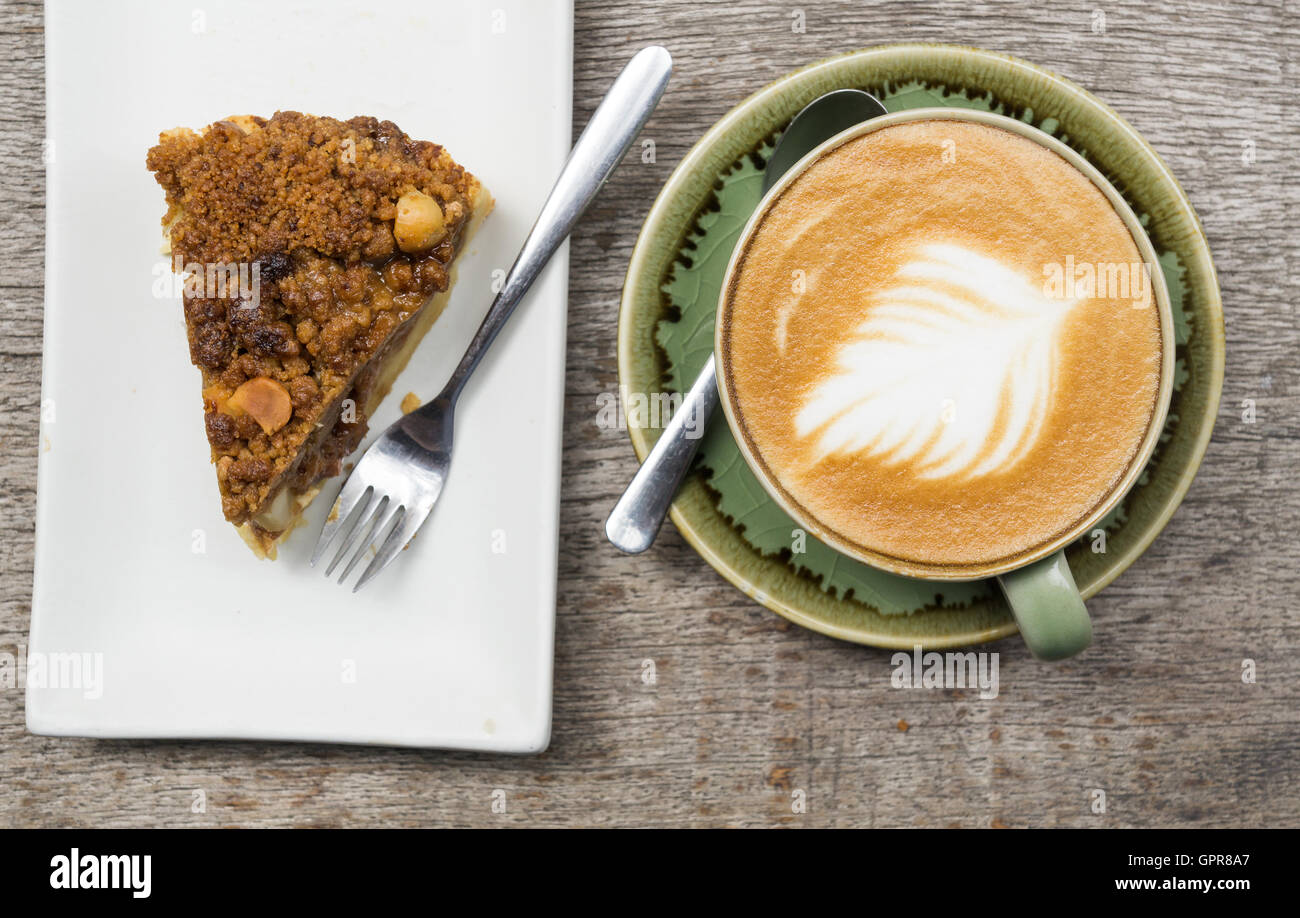 Apple crumble pie with big coffee latte cup Stock Photo
