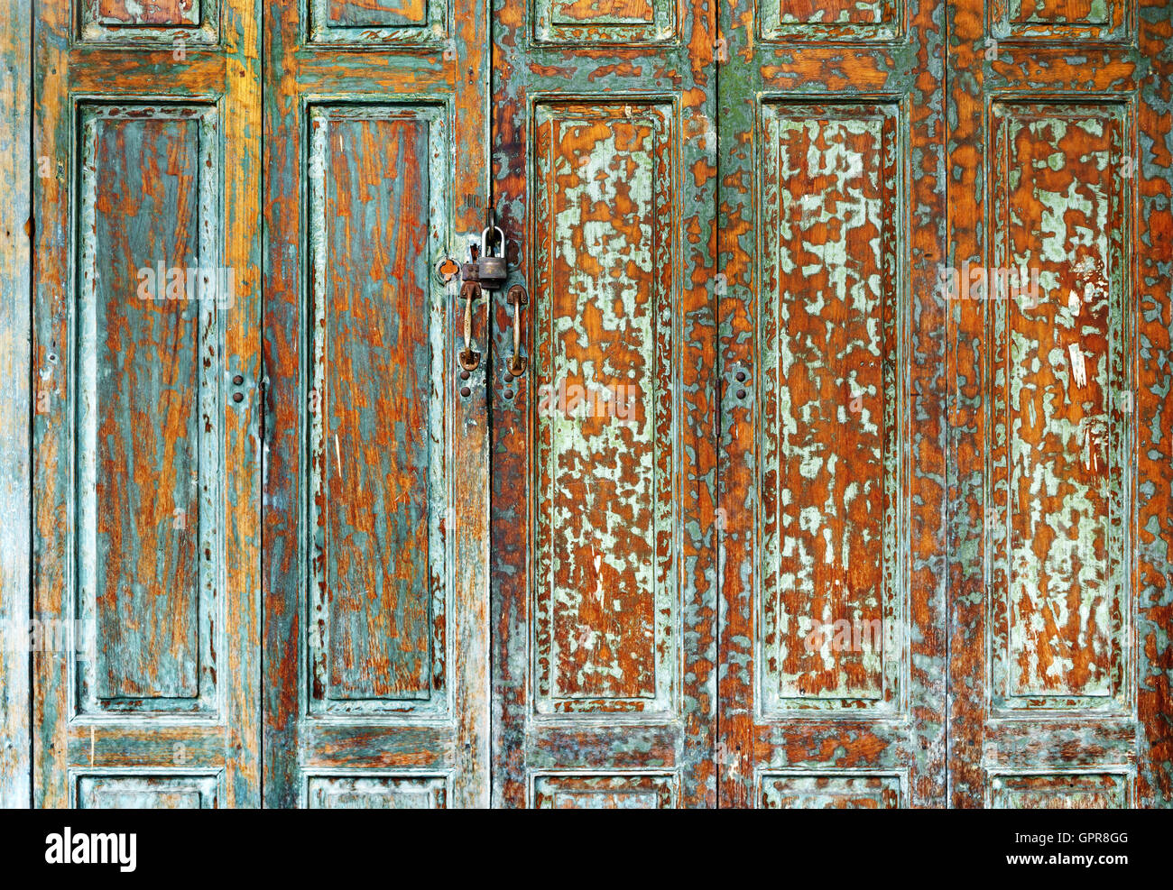 Green vintage grunge wooden door background texture Stock Photo