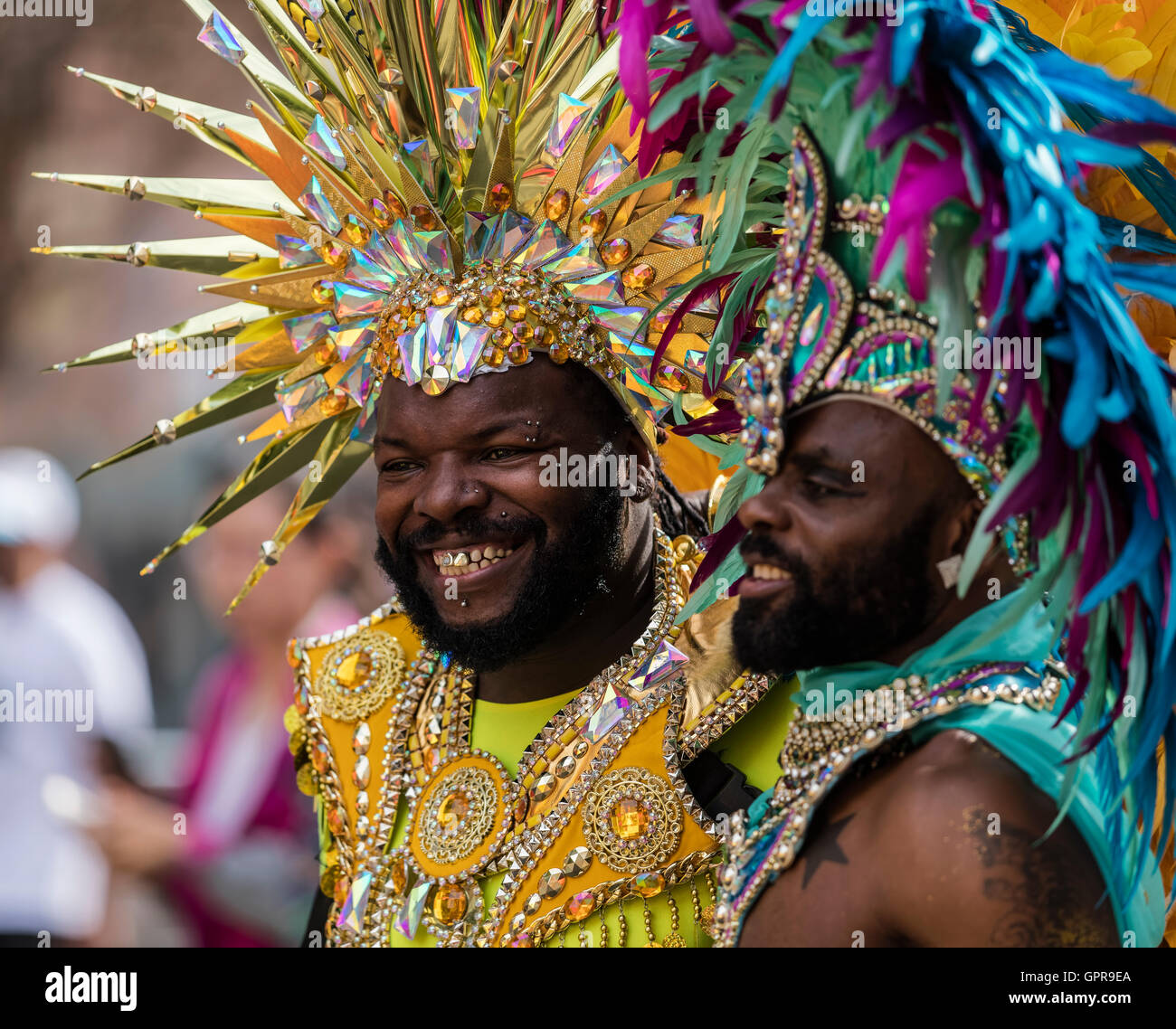 Two Afro Caribbean men in bright costumes at the Notting Hill Carnival ...