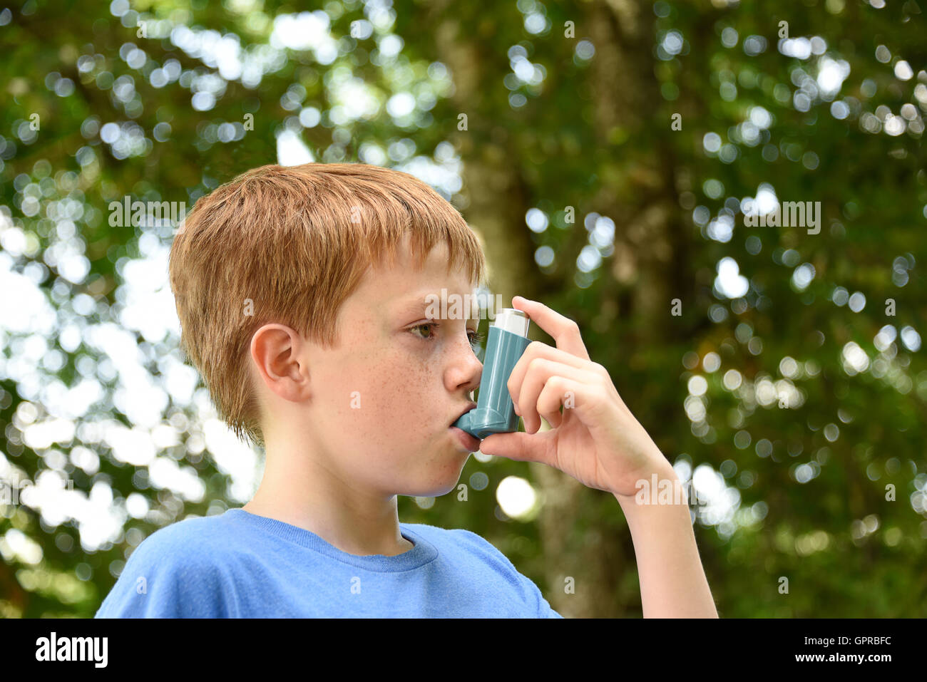 Boy with Asthma inhaler Stock Photo