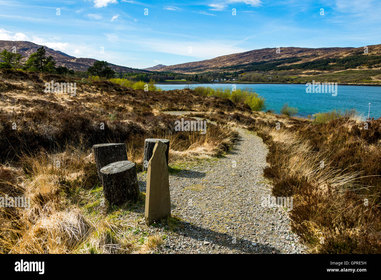 Memorial stone to Irvine Butterfield on the path to the otter hide, by Loch Scresort, Kinloch, Isle of Rum, Scotland, UK. Stock Photo