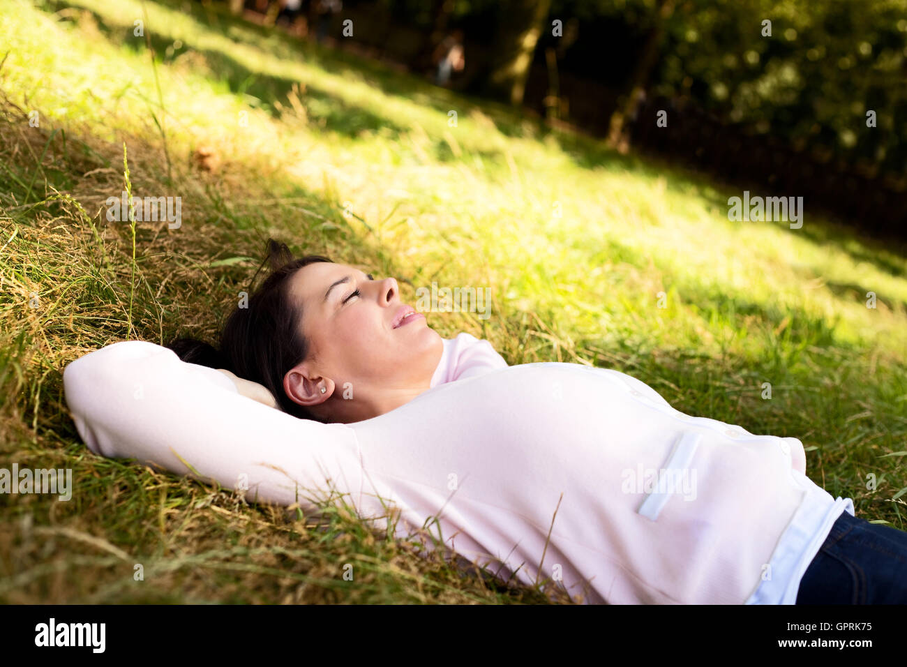 Woman relaxing park hi-res stock photography and images - Alamy