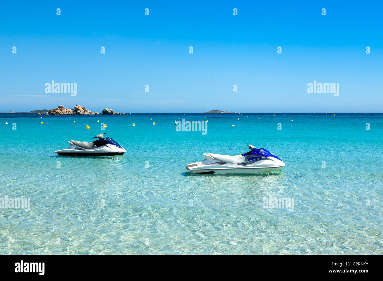 Jet ski mooring in the turquoise water of Rondinara beach in Corsica