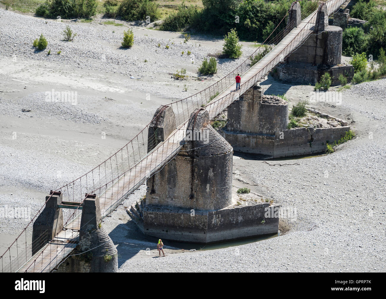 Old footbridge across  the Vjosa river, using Ali pashas original foundations, at Tepelena, southern Albania. Stock Photo