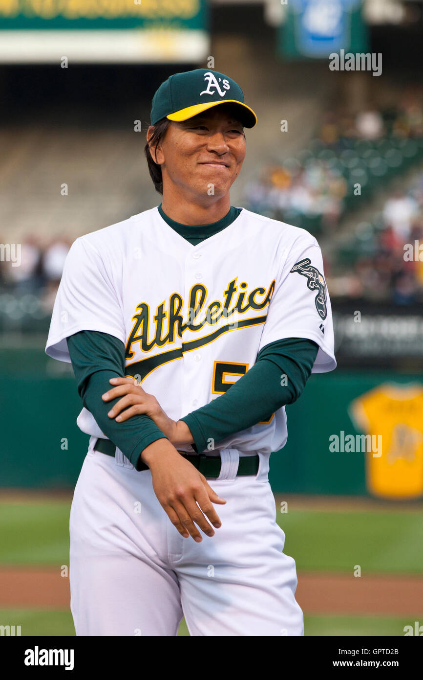 April 1, 2011; Oakland, CA, USA;  Oakland Athletics left fielder Hideki Matsui (center) is introduced before the game against the Seattle Mariners at Oakland-Alameda County Coliseum. Stock Photo