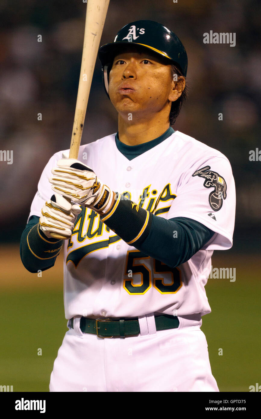 April 1, 2011; Oakland, CA, USA;  Oakland Athletics left fielder Hideki Matsui (55) at bat against the Seattle Mariners during the seventh inning at Oakland-Alameda County Coliseum. Stock Photo
