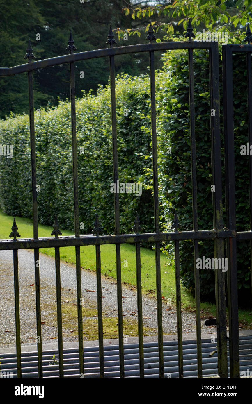 Closed gate at entrance to drive. Stock Photo