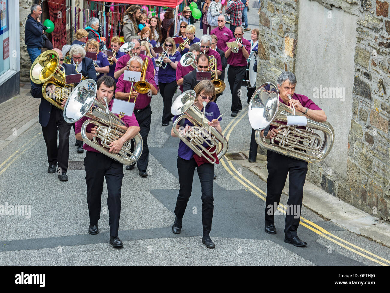 A brass band playing on carnival day in the streets of St.Agnes, Cornwall, England, UK Stock Photo