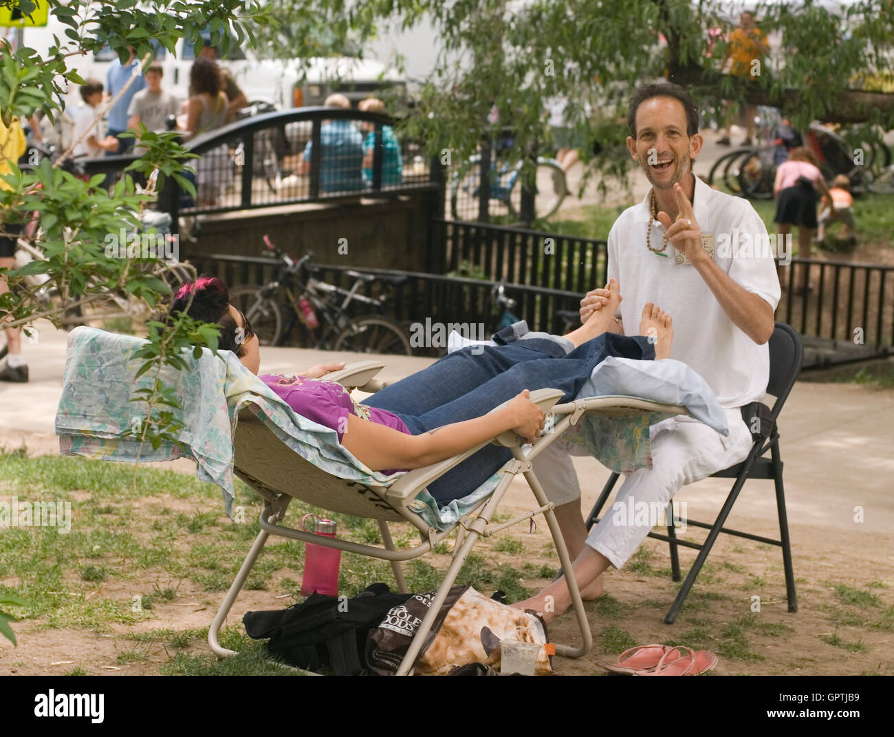 Foot massage at Boulder's Central Park near Boulder Creek Stock Photo