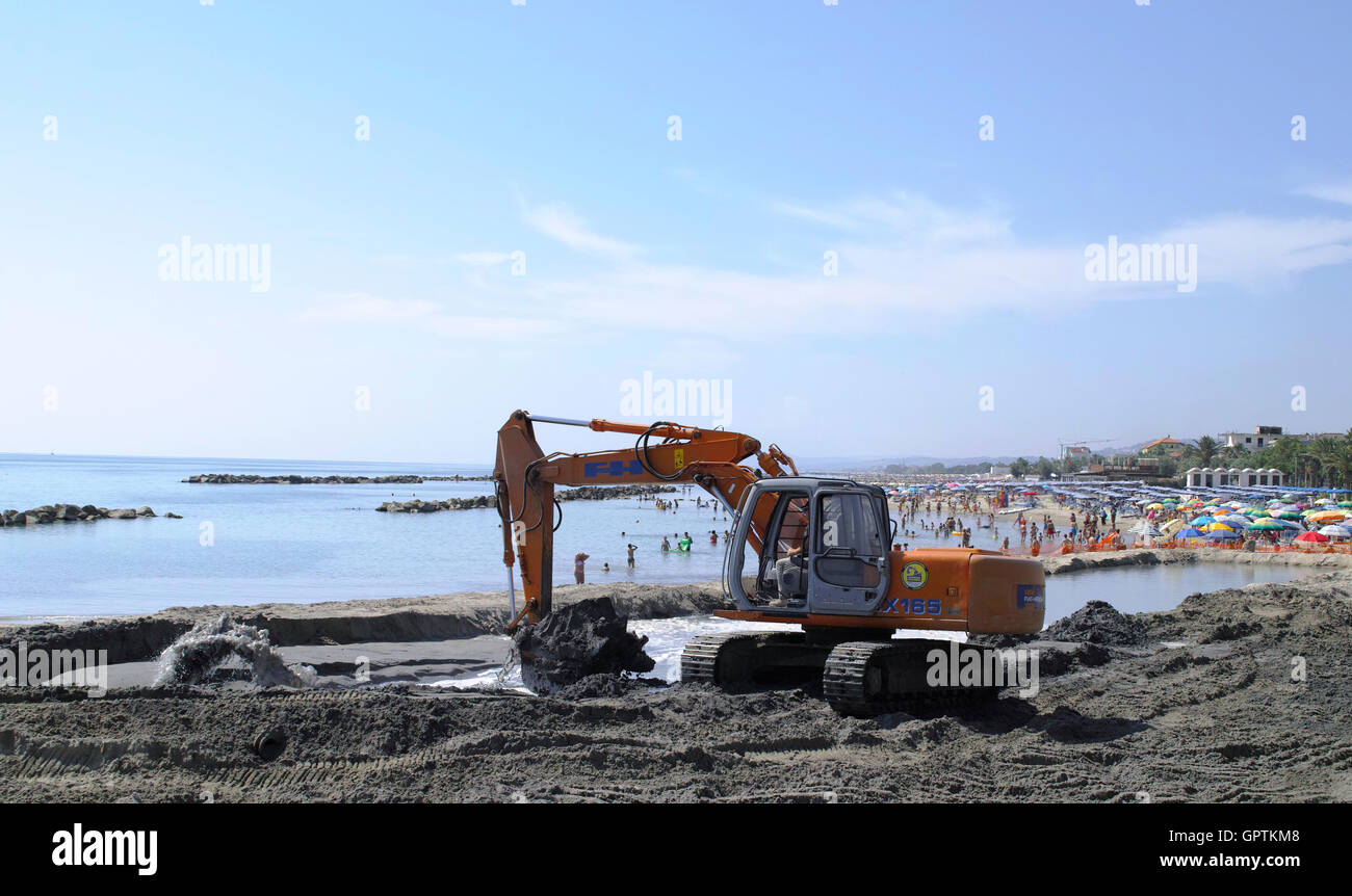 excavator on beach Stock Photo - Alamy