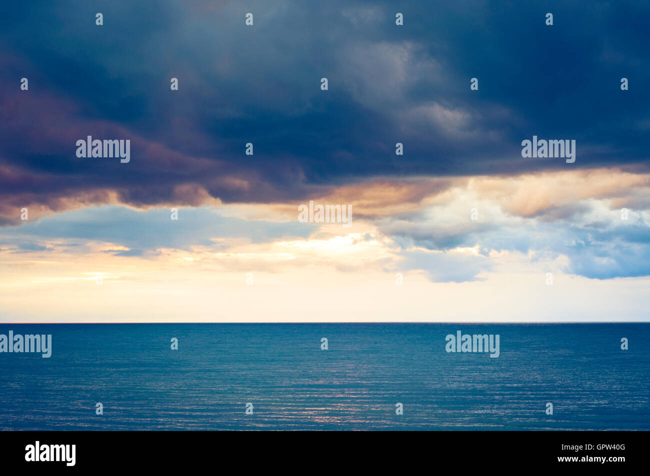 Dark clouds over the sea Stock Photo - Alamy