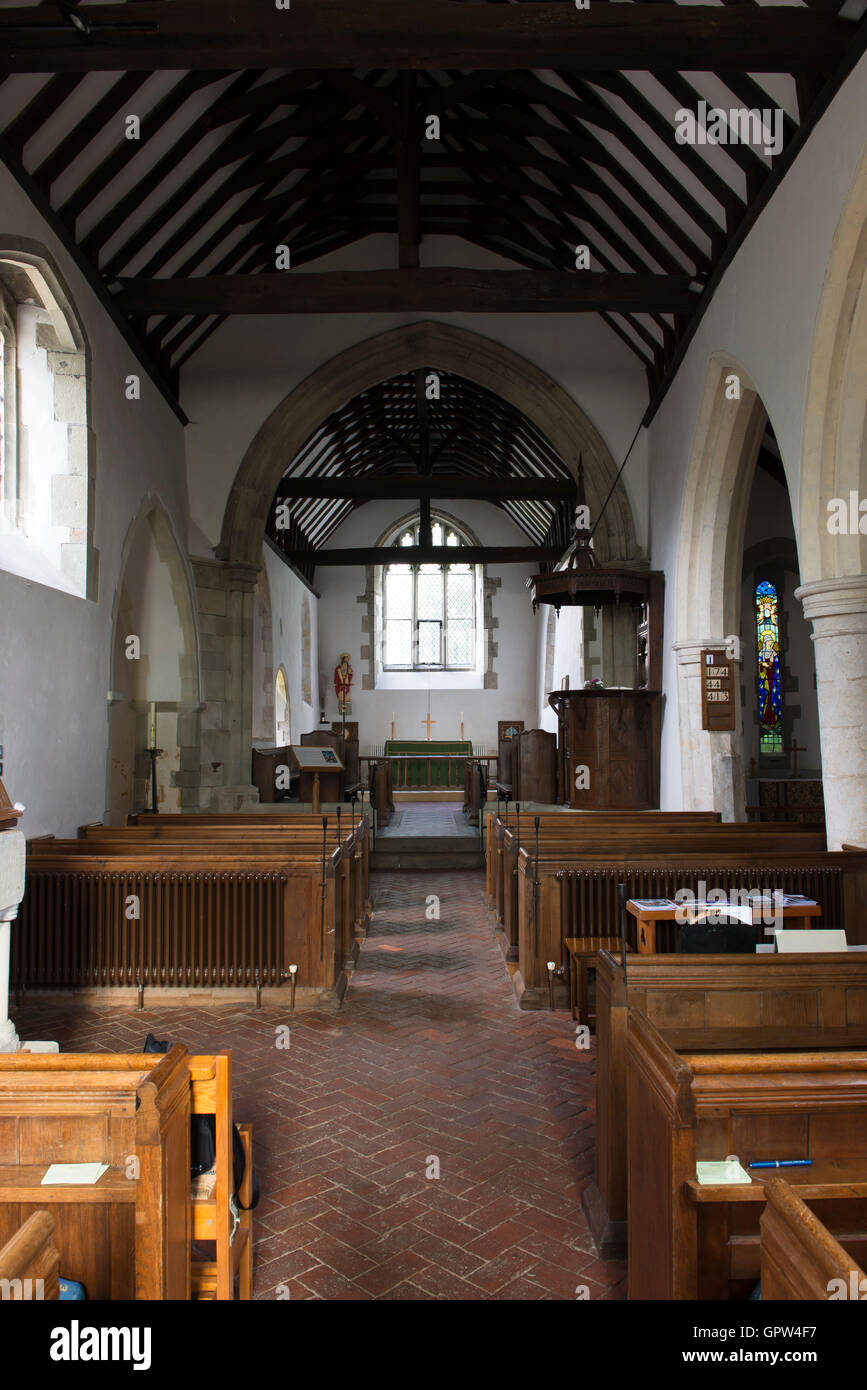 The aisle of the church of St Mary and St Peter in the East Sussex village of Wimington, England, UK Stock Photo