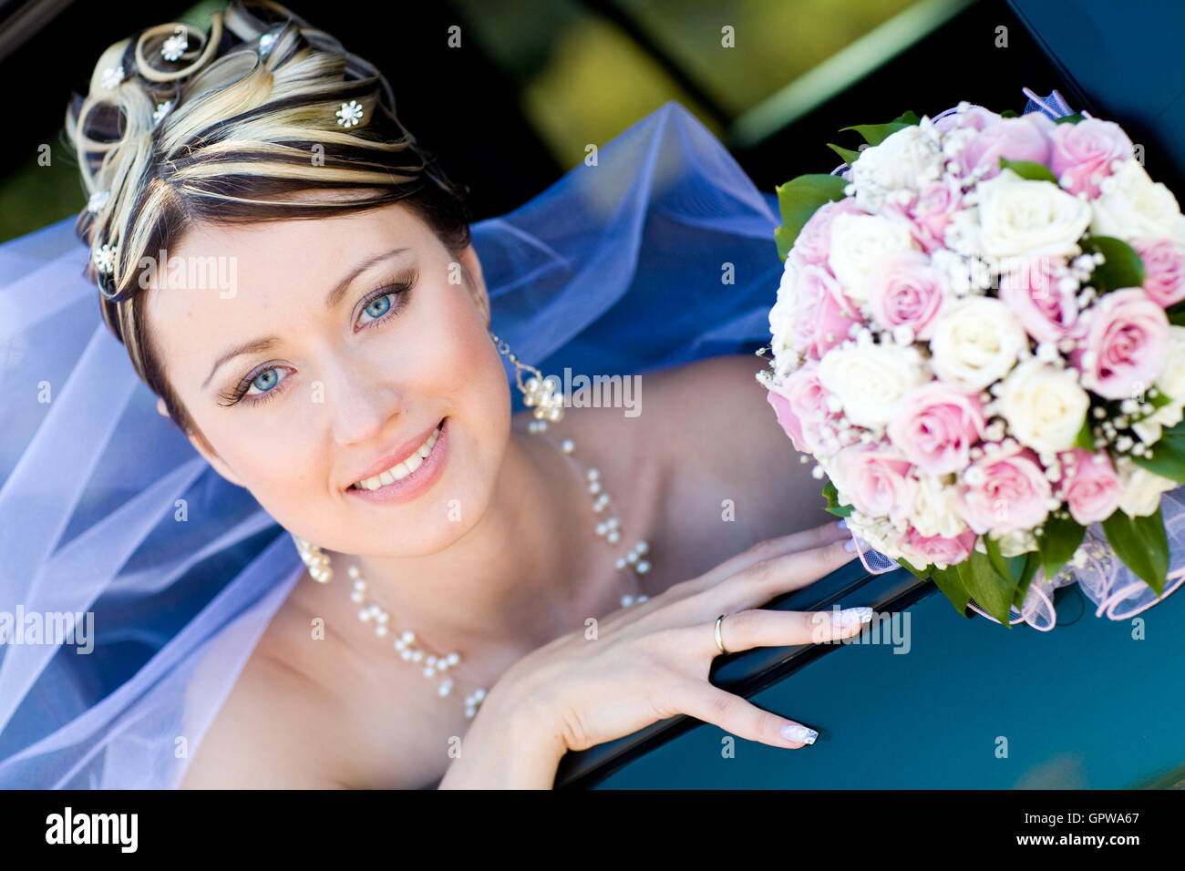 portrait of the bride in the wedding car Stock Photo - Alamy