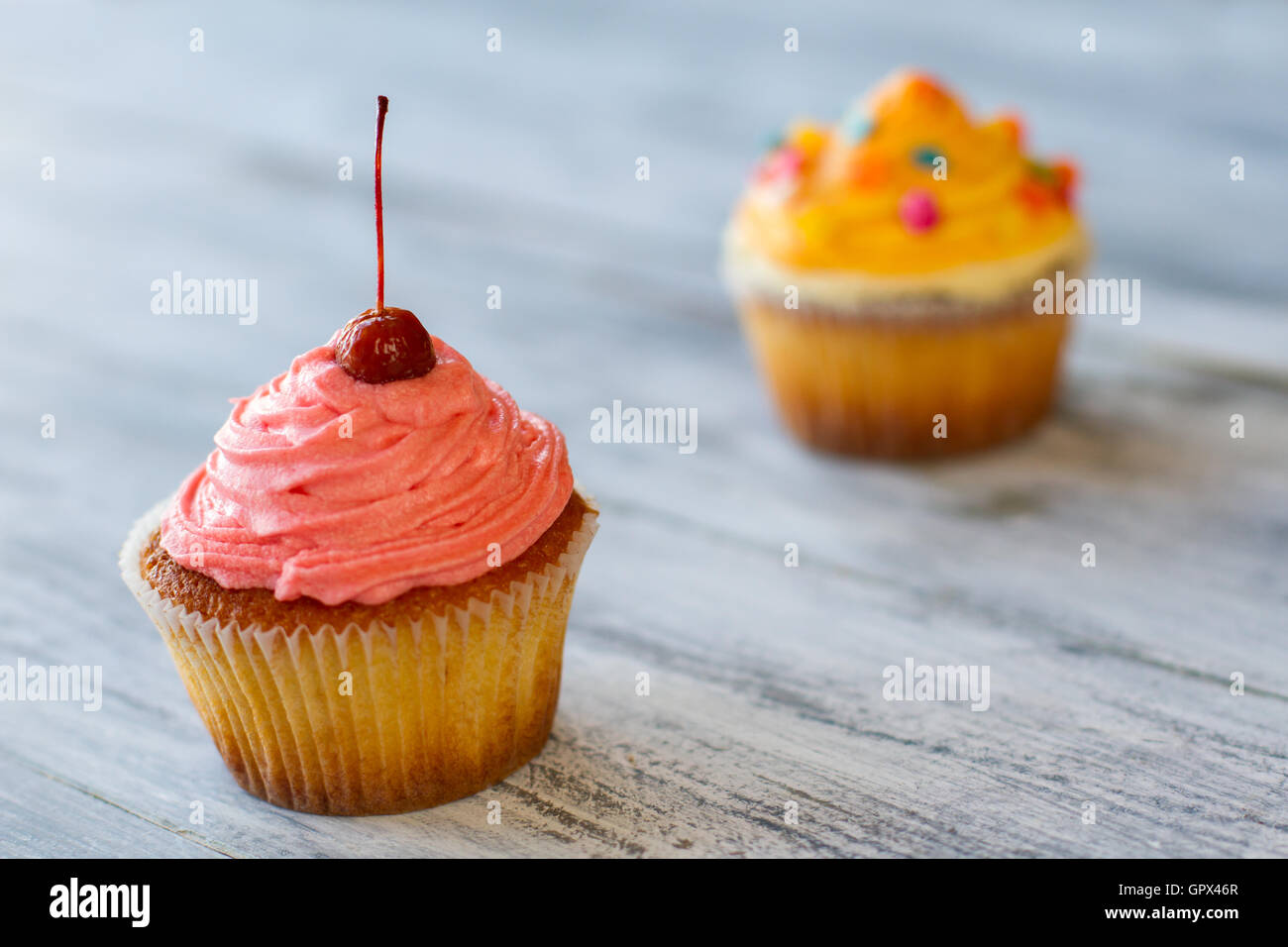Cherry on top of cupcake Stock Photo Alamy