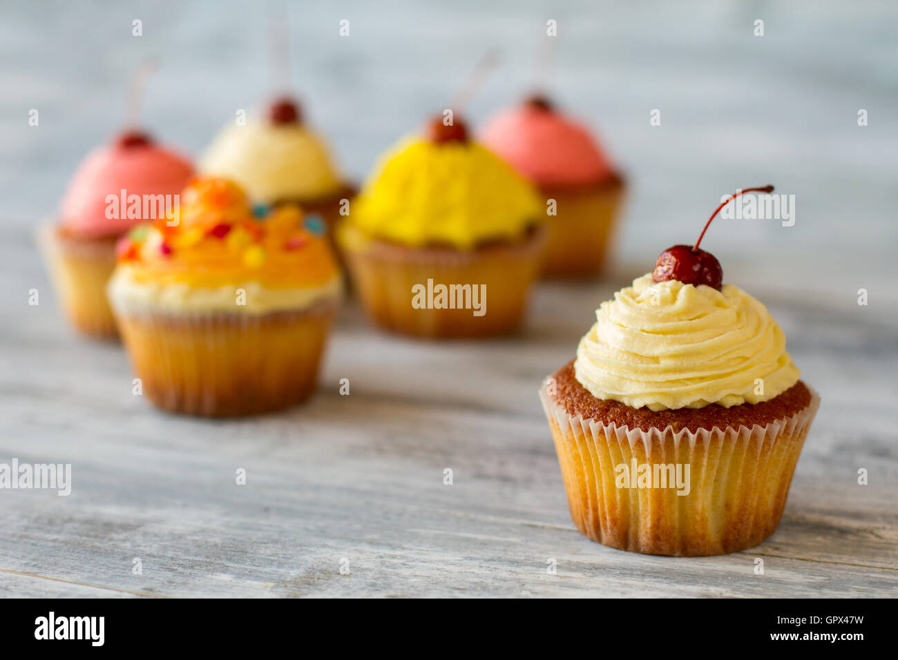 Cupcake with beige frosting Stock Photo Alamy