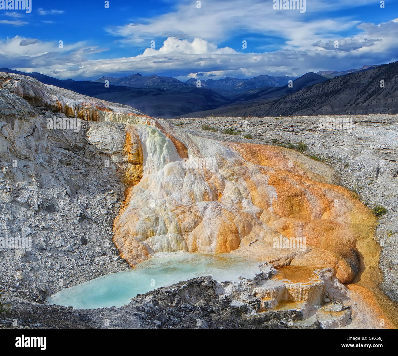 Mammoth Springs landscape, Yellowstone, lava flow.  Wyoming.  Showing vast landscape with solidified travertine and algae. Stock Photo