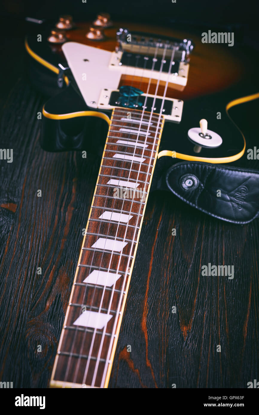 Electric guitar fretboard on wooden table close up Stock Photo Alamy
