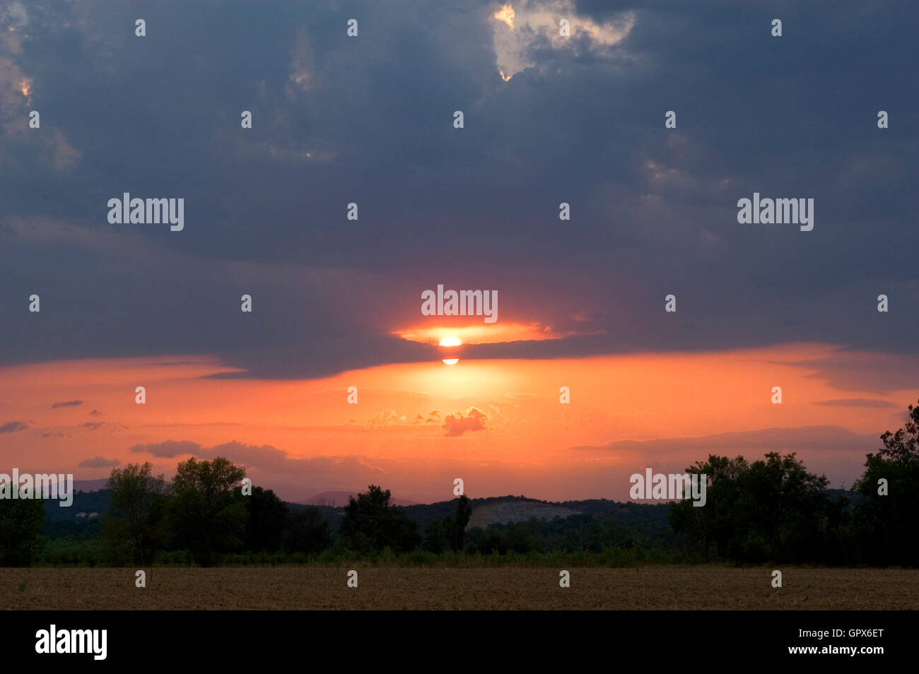 Background stormy sky with sun Stock Photo - Alamy