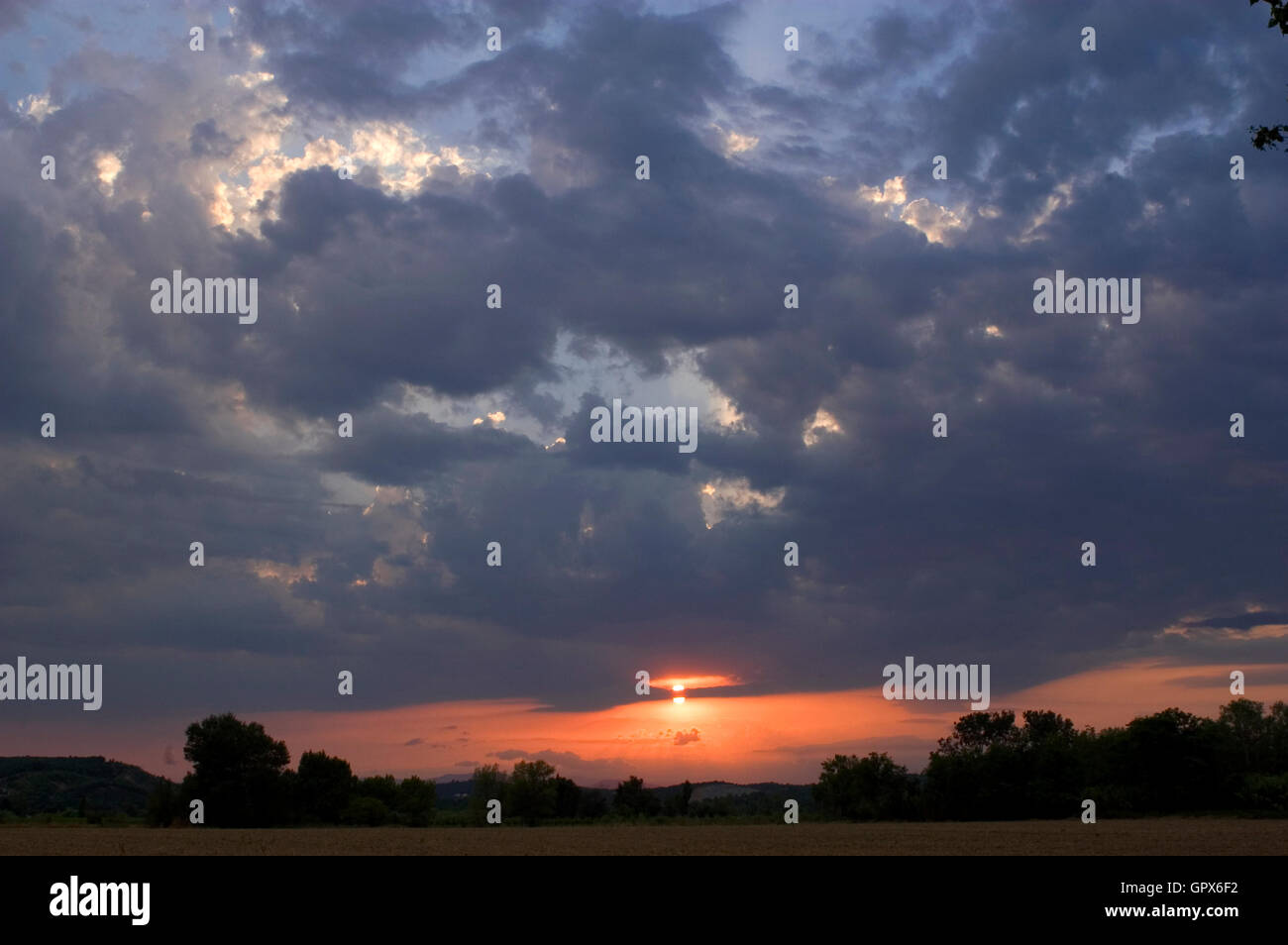 Background stormy sky with sun Stock Photo - Alamy
