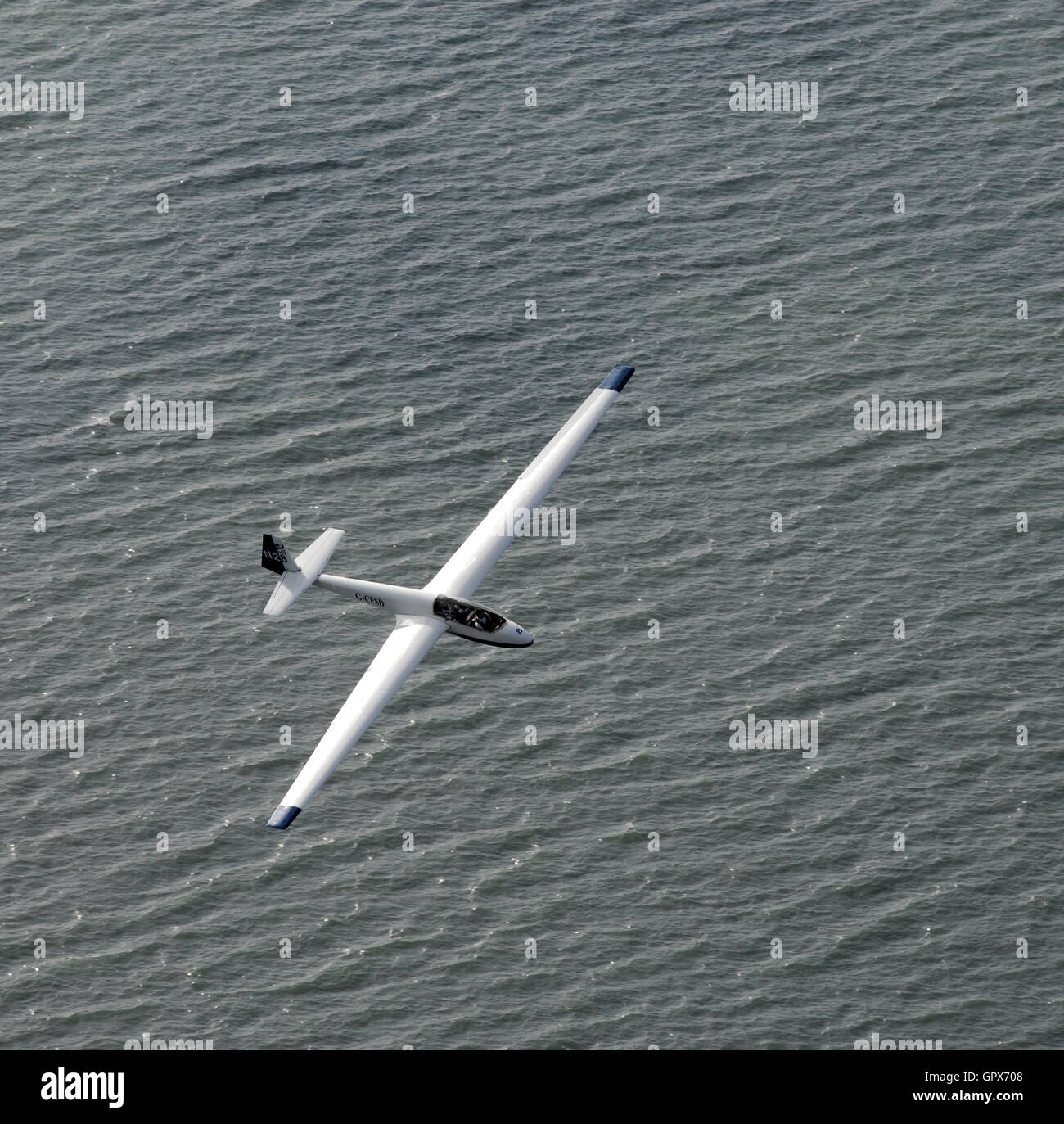 AJAXNETPHOTO. 30TH JULY, 2011. LEE-ON-THE-SOLENT, ENGLAND. - SOARING OVER THE SEA - A PNGC GLIDER FROM DAEDALUS AIRFIELD SOARS OVER A RIPPLING SOLENT SEA.  PHOTO;JONATHAN EASTLAND/AJAX REF:D2X 110209 1584 Stock Photo