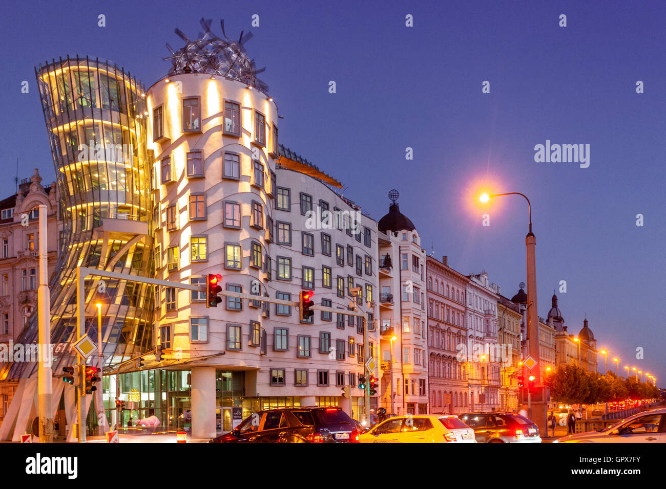 Prague Dancing House by Frank Gehry building at dusk, Prague apartments residential houses, night is coming blue hour Stock Photo