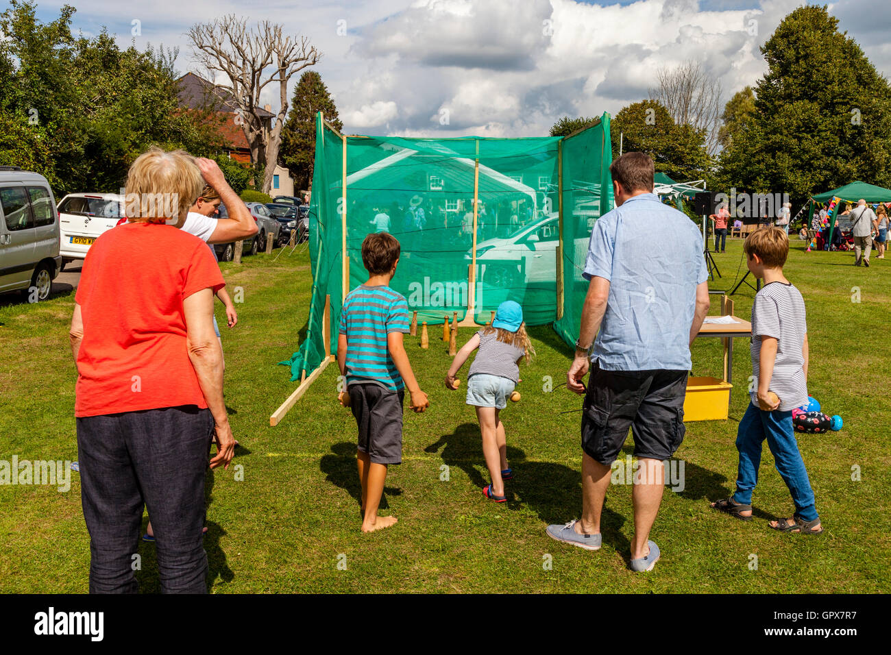 Families Playing Skittles At The Annual Alfriston Village Fete, Alfriston, East Sussex, UK Stock Photo