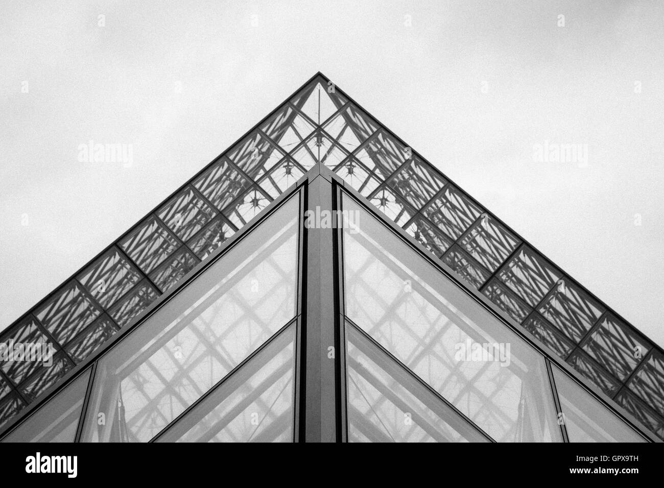 Famous Louvre Museum Pyramid made of glass in Paris, France Stock Photo