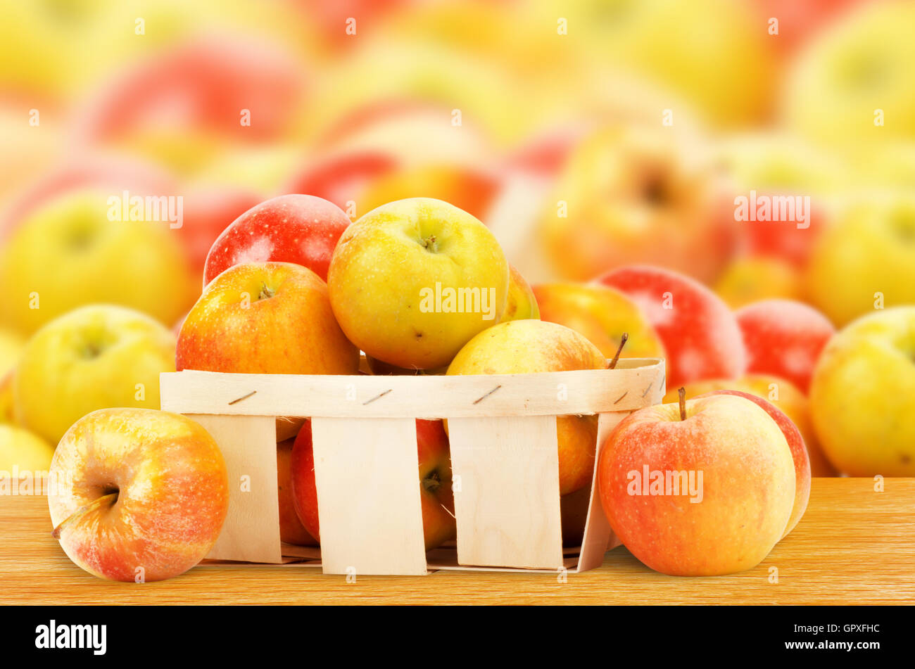 Fresh and colorful apples in basket Stock Photo - Alamy