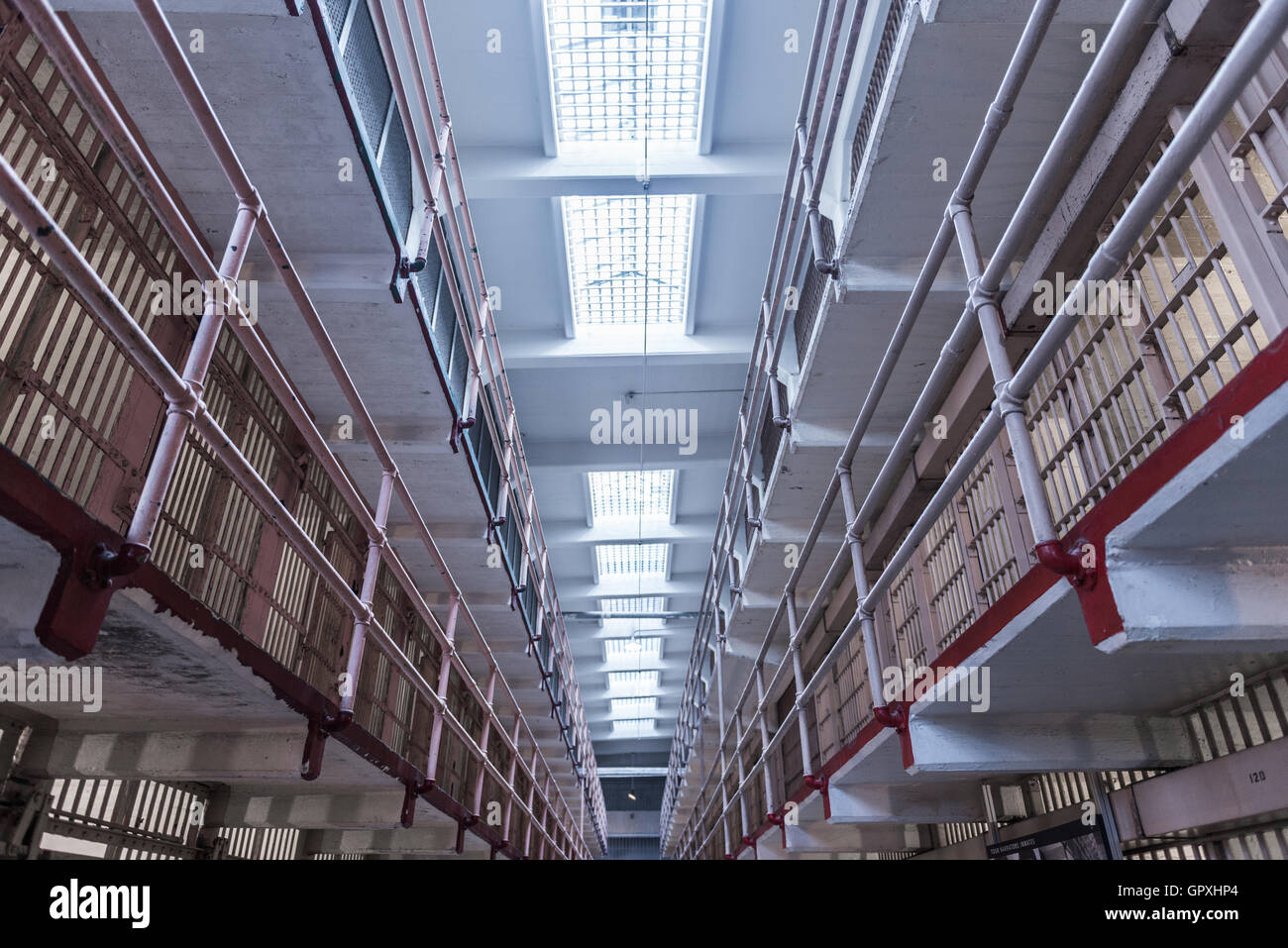 Prison Corridor inside the Alcatraz Penitentiary, with the row of rooms Stock Photo