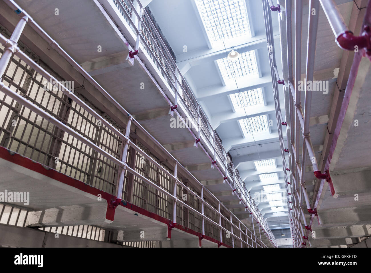 Prison Corridor inside the Alcatraz Penitentiary, with the row of rooms Stock Photo