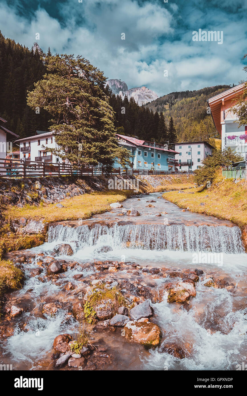 mountain river flowing through village in the Alps Stock Photo - Alamy