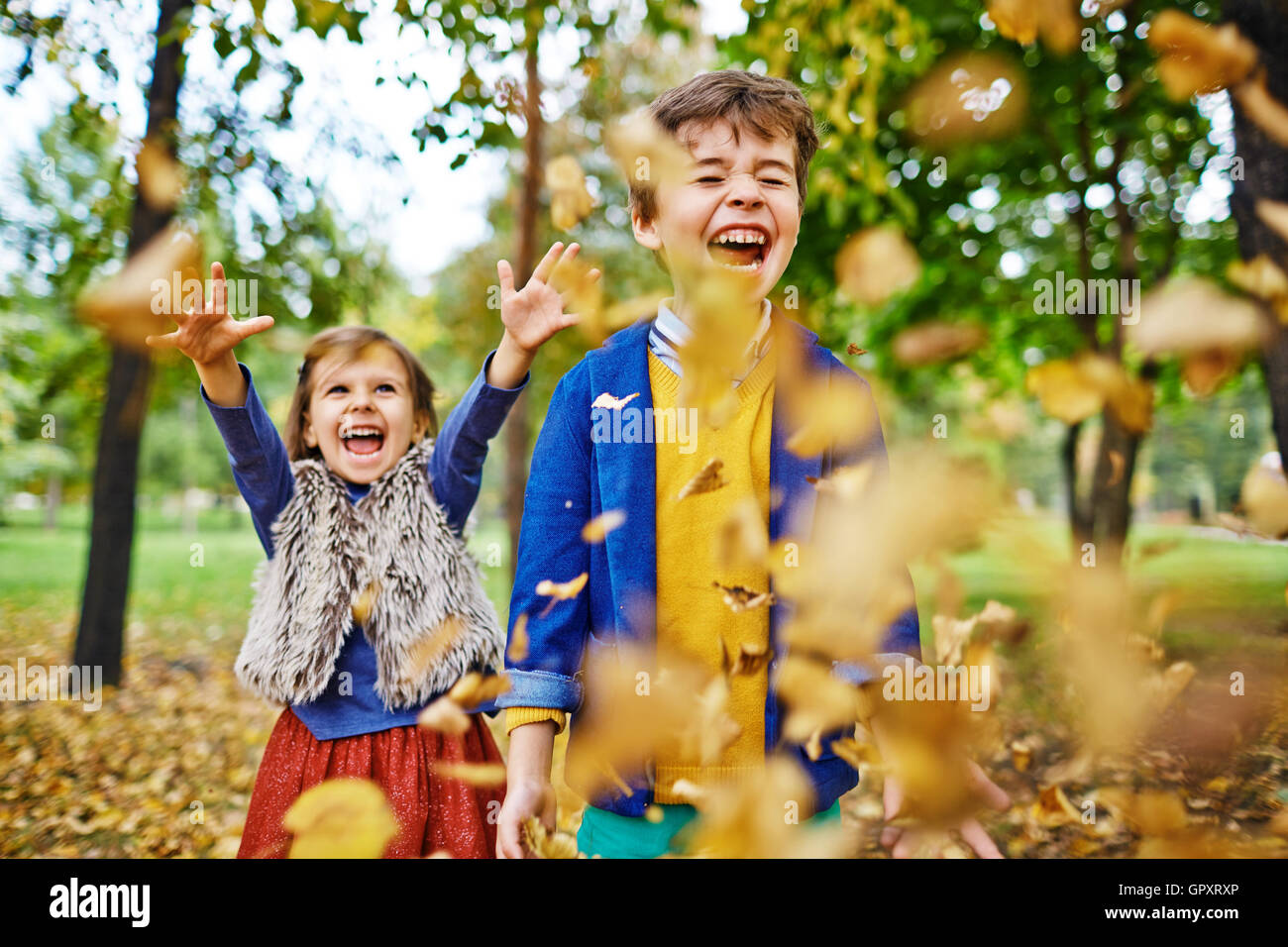 Brother and Sister in Autumn Park Stock Photo - Alamy