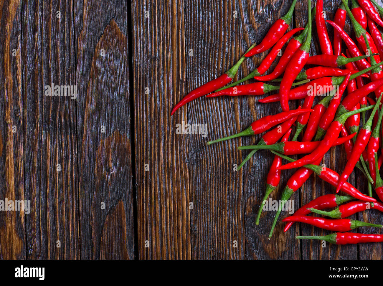 red hot chilli peppers on a table Stock Photo - Alamy