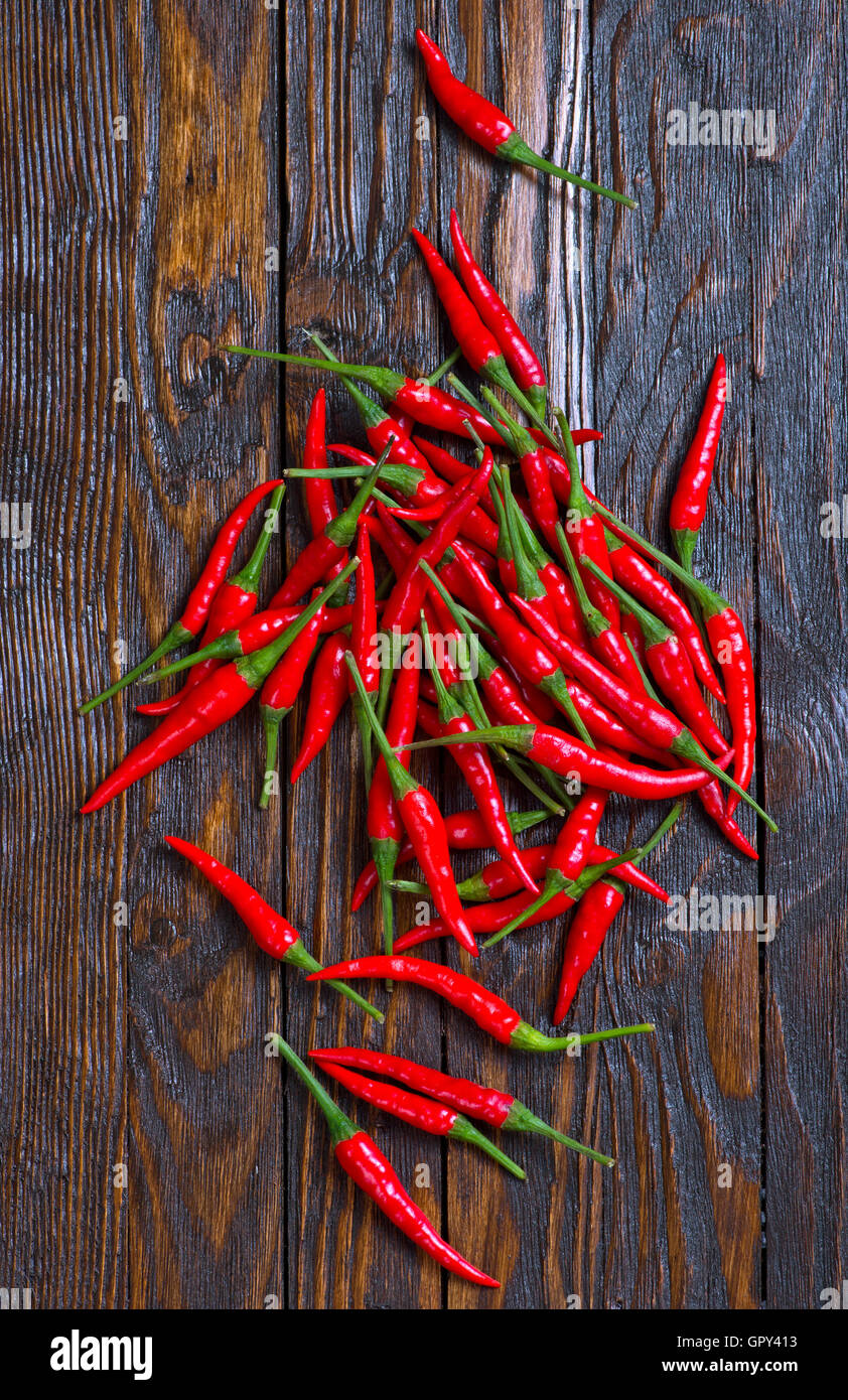 red hot chilli peppers on a table Stock Photo - Alamy