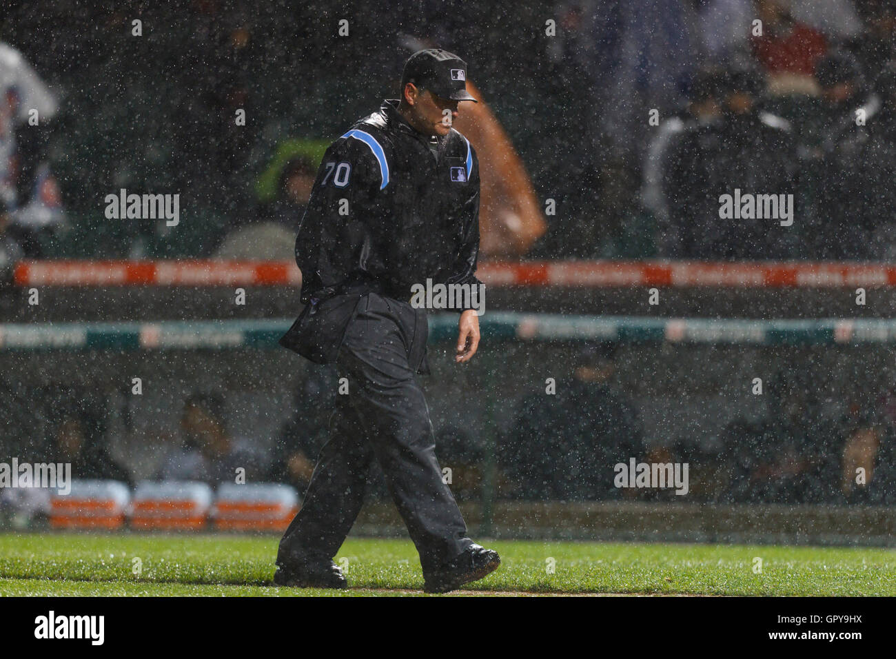 May 14, 2011; Chicago, IL, USA;  Home plate umpire D.J. Reyburn (70) inspects the infield before calling a rain delay during the seventh inning between the Chicago Cubs and the San Francisco Giants at Wrigley Field. Stock Photo